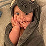 baby, child, face, hands, towel, elephant, hood, blue_eyes, cute, wrapped, blanket, soft, skin, indoor, portrait, infant, expression, closeup, cozy, warm