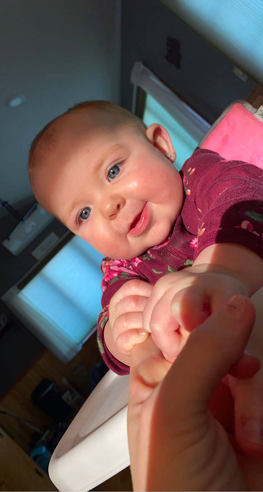 Lorelai is registered to the contest to win money with this photo: arm, baby, baby_toddler_clothing, cheek, comfort, finger, gesture, hand, happy, human_body, joint, lip, mouth, neck, nose, person, shoulder, skin, smile, thumb