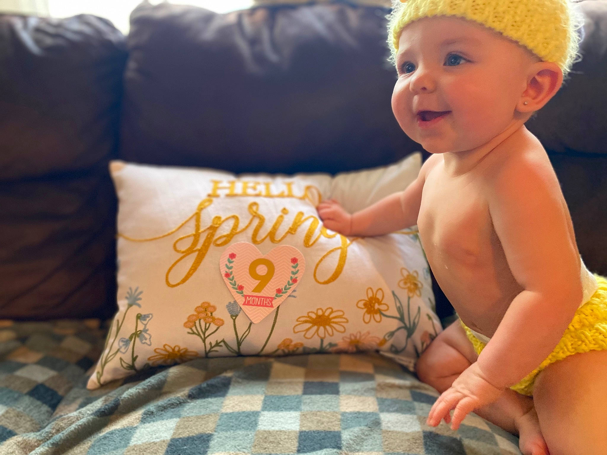 Lorelai joined the competition — help win amazing prizes! baby, baby_playing_with_toys, baby_toddler_clothing, barefoot, child, comfort, couch, finger, foot, fun, green, happy, headwear, human_leg, linens, pattern, person, skin, textile, thigh