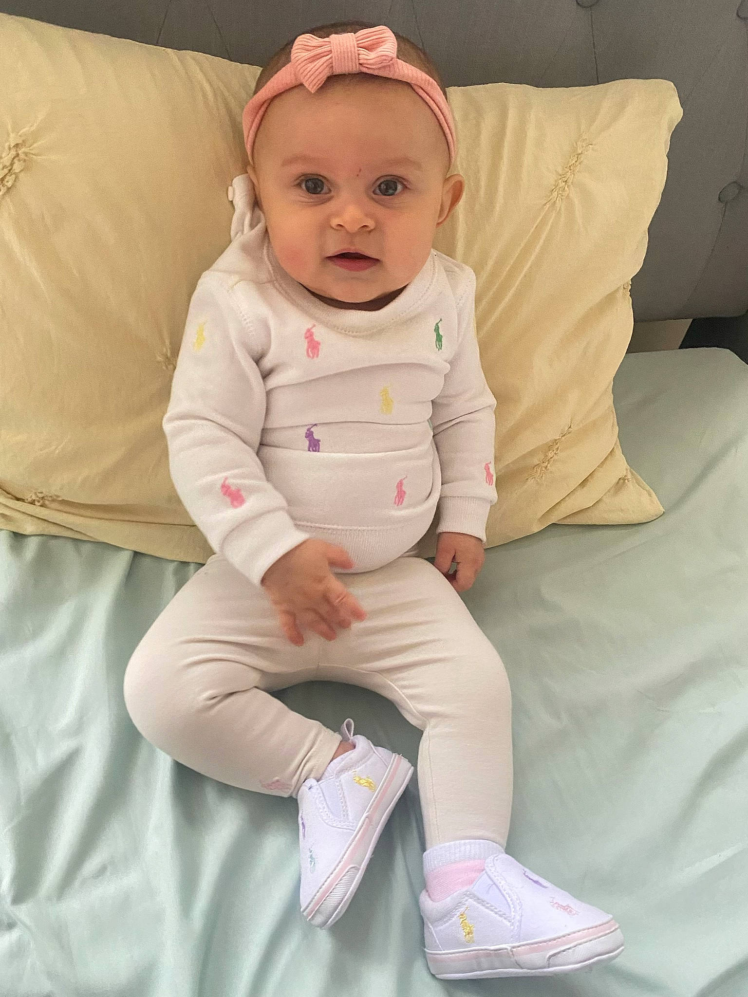 Jacie joined the competition — help win amazing prizes! baby, baby_toddler_clothing, cheek, child, comfort, eye, face, head, headwear, human_leg, knee, linens, person, pink, sitting, skin, sleeve, smile, textile, thigh