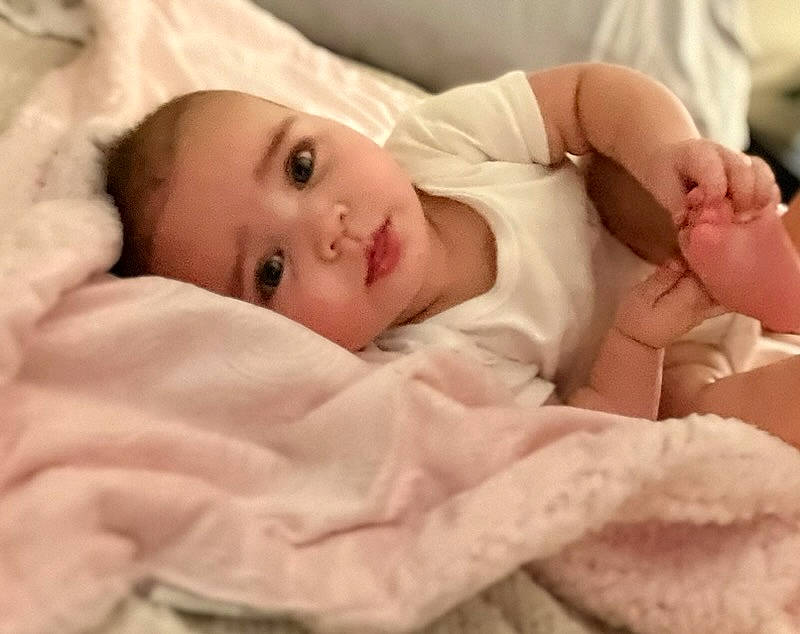 Anahi joined the competition — help win amazing prizes! baby, baby_toddler_clothing, cheek, child, comfort, eyelash, finger, fur, hat, linens, lip, mammal, no_expression, nose, peach, person, portrait_photography, room, skin, sleeve