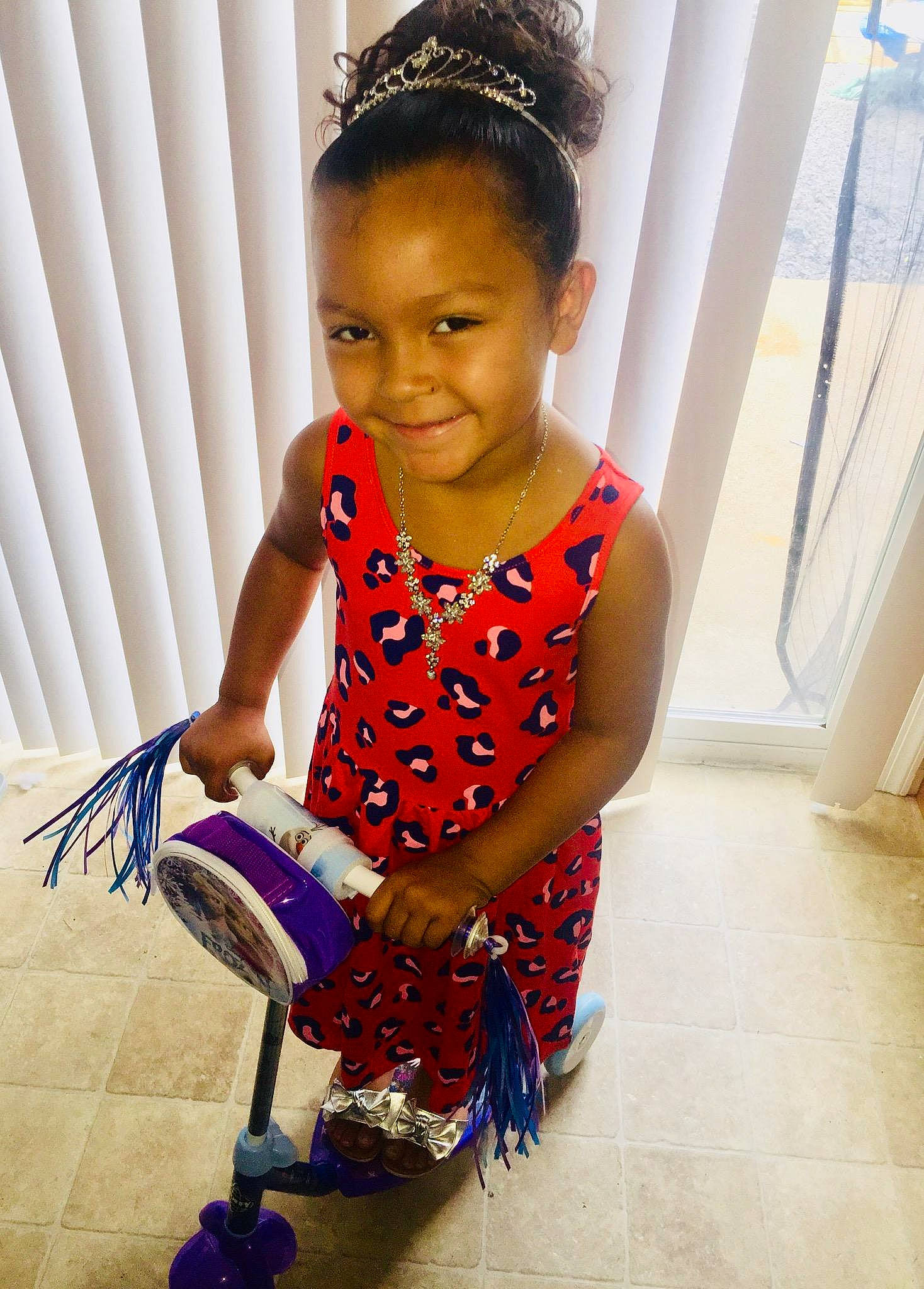 Leilanni is registered to the contest to win money with this photo: abdomen, child, child_model, costume, design, fashion_accessory, fun, girl, hair_accessory, hairstyle, happiness, headgear, joint, joy, pattern, person, shoulder, sitting, skin, textile