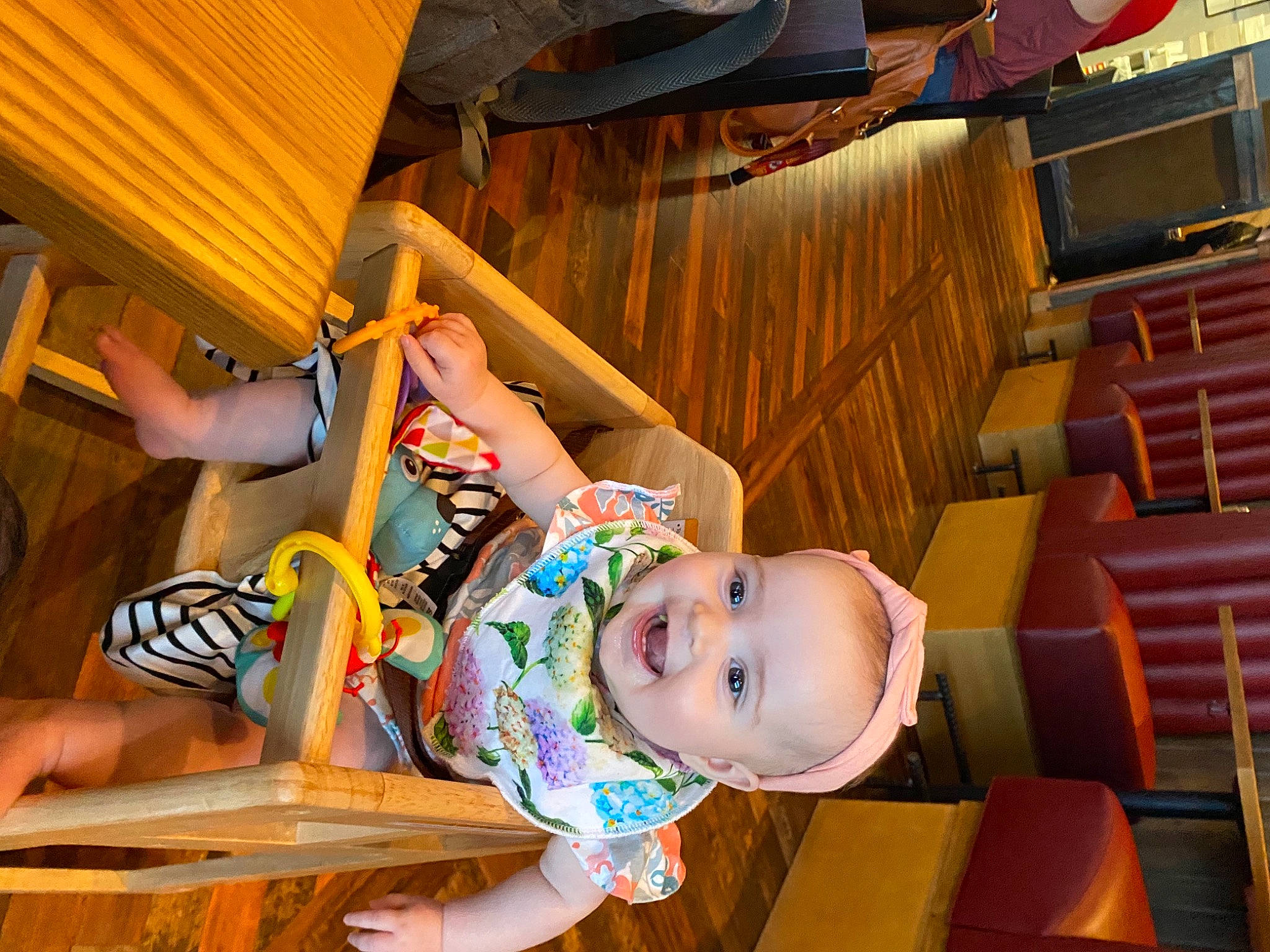 Kinsley is registered to the contest to win money with this photo: baby, baby_toddler_clothing, child, fun, happy, hat, human_leg, leisure, orange, person, play, recreation, room, sitting, smile, thigh, toddler, tree, vacation, wood