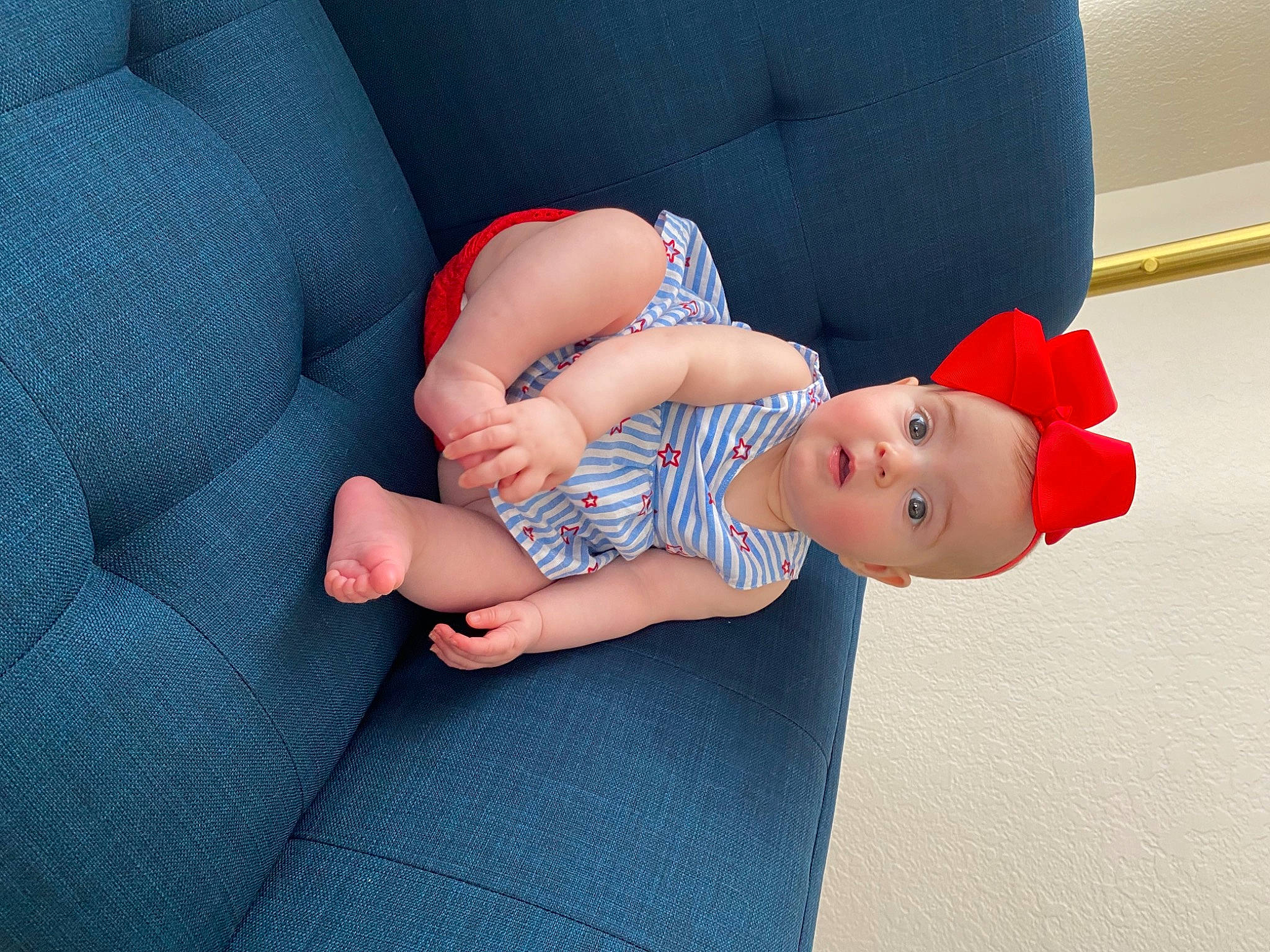 Kinsley joined the competition — help win amazing prizes! baby, baby_toddler_clothing, child, comfort, finger, foot, gesture, hat, human_body, human_leg, joint, knee, lap, nail, person, product, skin, sock, surprise, textile