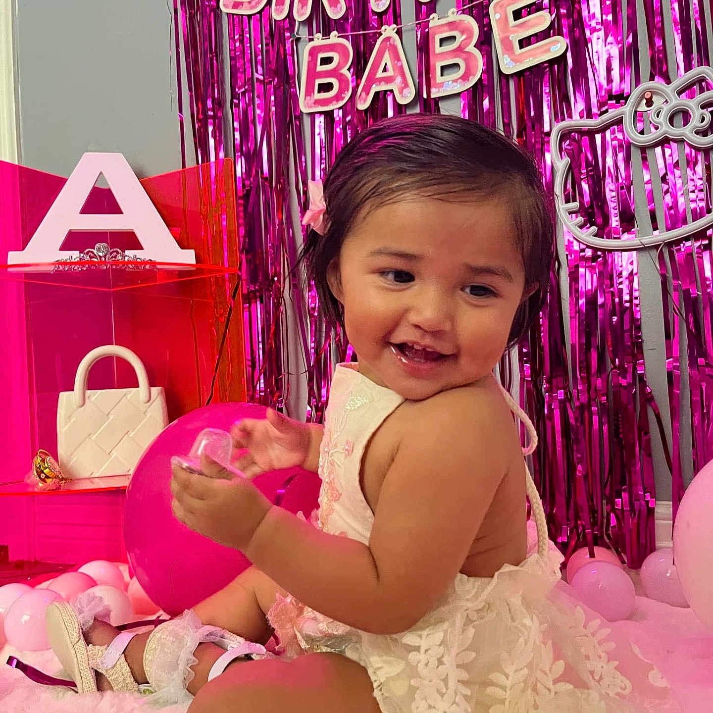 Adalynn Sinclair is registered to the contest to win money with this photo: accessories, baby, balloon, clothing, cream, dessert, dress, face, food, footwear, head, icecream, indoors, interiordesign, person, photography, portrait, purple, sandal, sitting