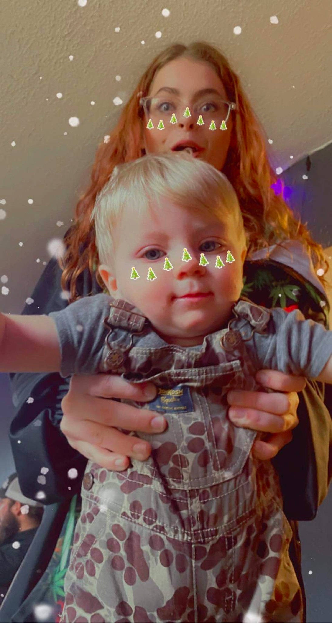 Maverick is registered to the contest to win money with this photo: blond, brown_hair, cheek, child, event, eyewear, fun, glasses, hairstyle, hand, happy, iris, lip, organ, person, pink, skin, standing, toddler, toy