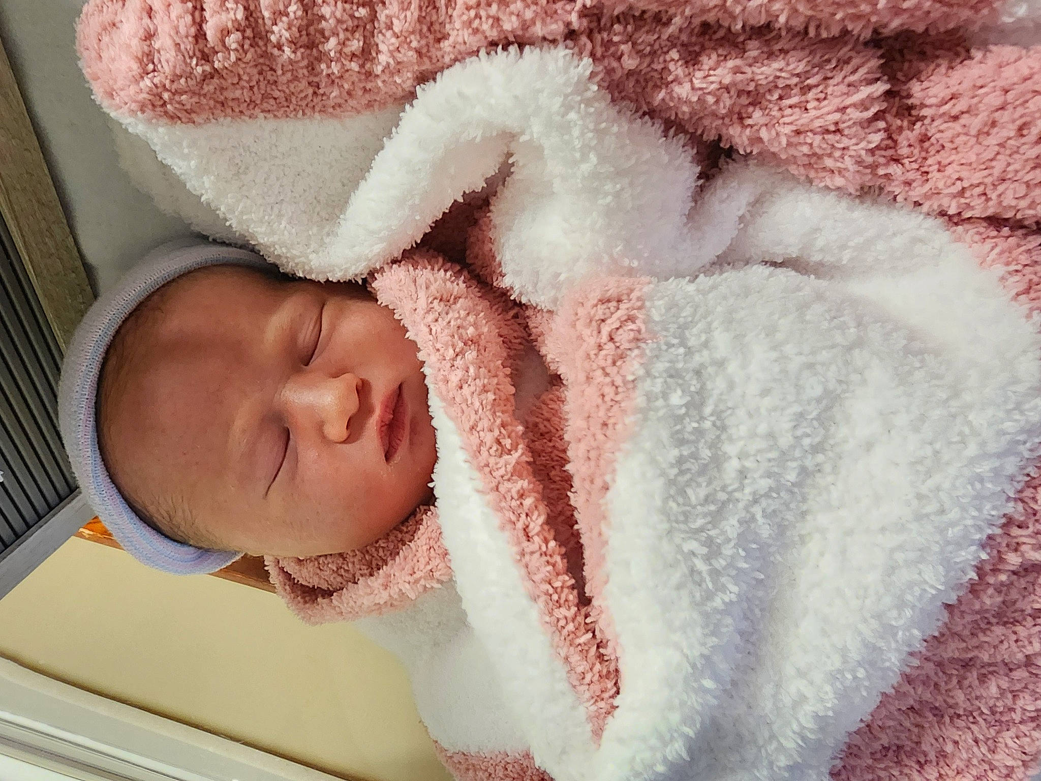 Mia is registered to the contest to win money with this photo: baby, baby_products, baby_safety, baby_sleeping, baby_toddler_clothing, bedtime, cheek, child, comfort, ear, fur, head, infant_bed, knit_cap, linens, nose, person, skin, sleeve, textile