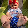 Ellieanna joined the competition — help win amazing prizes! baby, child, red_bow, headband, white_shirt, blue_shorts, stars, feet, hands, smile, sunlight, outdoor, chair, mesh_chair, green_fabric, portrait, cute, infant, playful, casual
