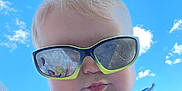 Ellieanna joined the competition — help win amazing prizes! baby, child, sunglasses, ponytail, blue_sky, clouds, tank_top, flamingo, reflection, cute, outdoor, portrait, summer, sunny, face, fashion, casual, cheeks, person, headwear