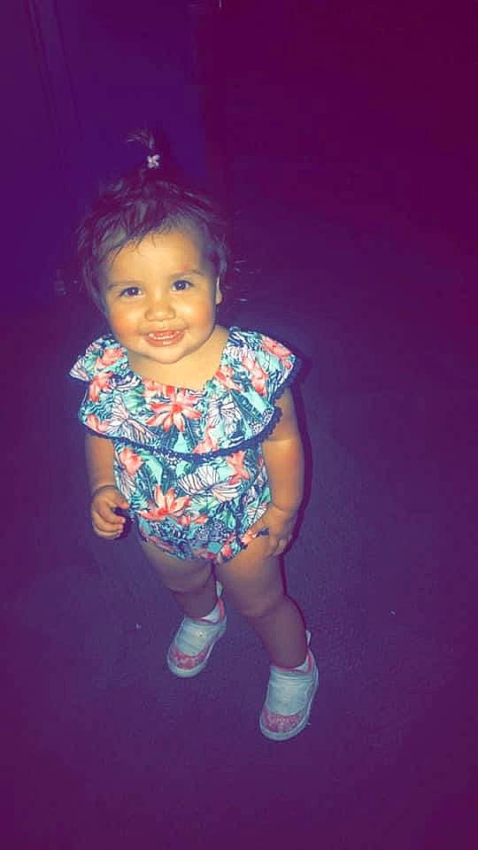 Kendra is registered to the contest to win money with this photo: baby_toddler_clothing, darkness, electric_blue, flash_photography, footwear, fun, happy, human_body, joy, magenta, nose, pattern, person, pink, purple, sitting, skin, sleeve, smile, t_shirt