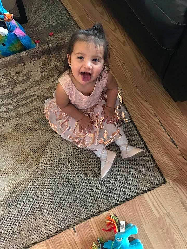 Kendra is registered to the contest to win money with this photo: blue, child, doll, fashion_accessory, floor, flooring, fun, happy, hardwood, jewellery, leisure, pattern, person, play, room, sitting, smile, textile, toddler, toy
