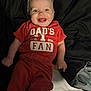 Emmett joined the competition — help win amazing prizes! baby, child, smiling, red_clothing, pants, shirt, bed, bedding, blanket, person, happy, infant, cute, lying_down, indoors, face, blue_eyes, joyful, toddler, casual