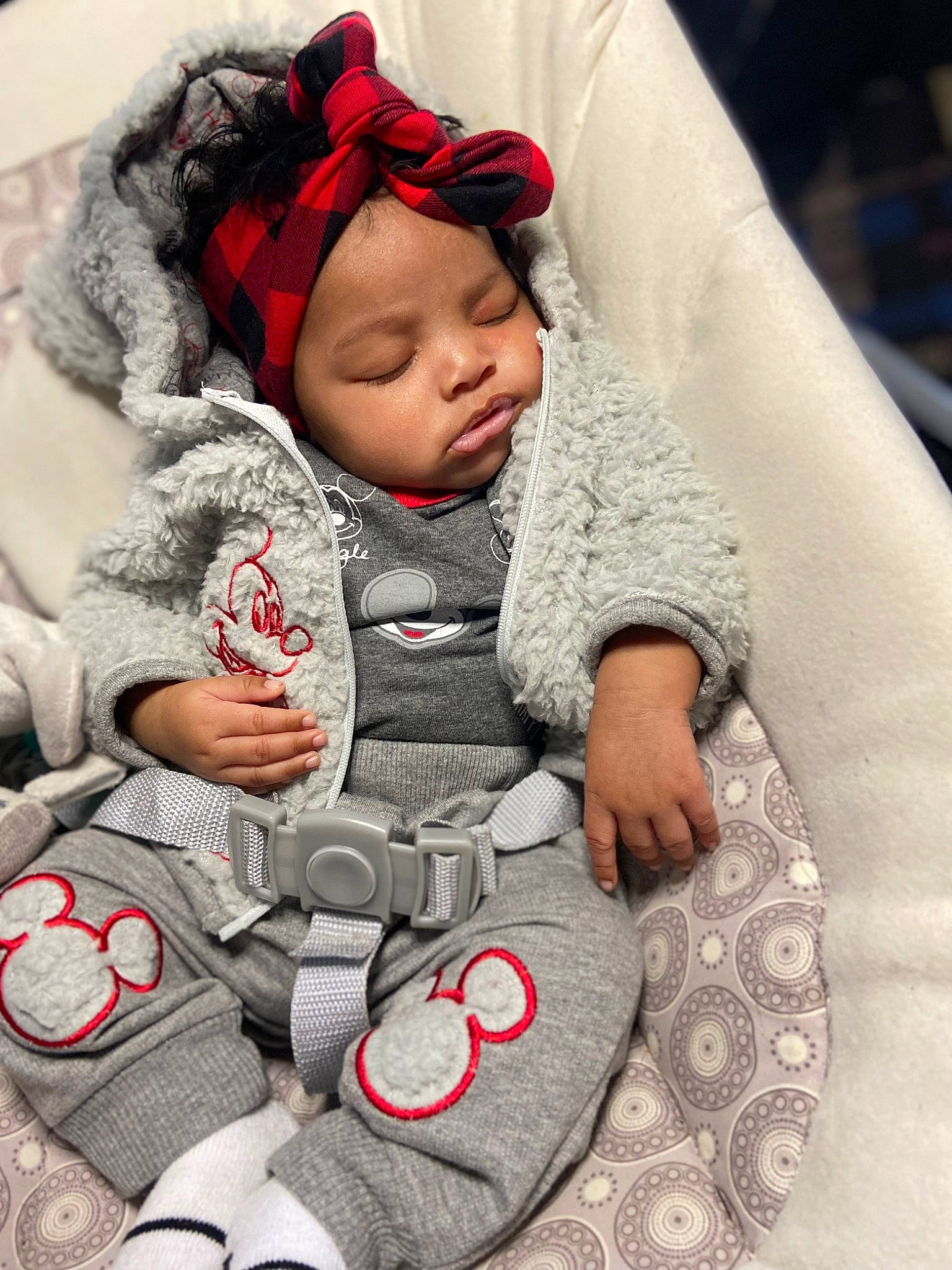 Robyn joined the competition — help win amazing prizes! baby, baby_carriage, baby_products, baby_sleeping, baby_toddler_clothing, bag, cap, cheek, child, comfort, face, facial_expression, finger, happy, head, headwear, human, person, red, sitting