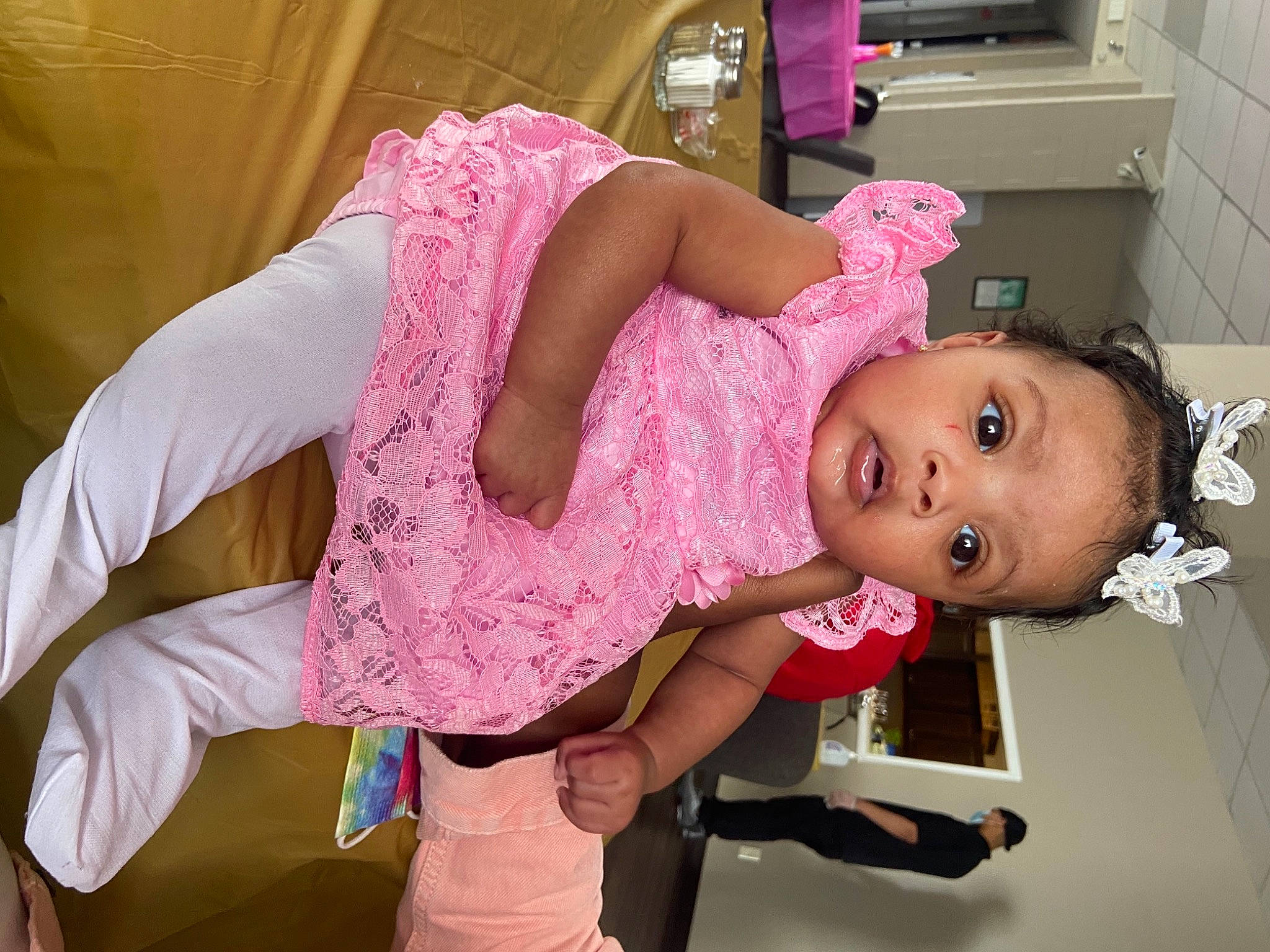 Robyn is registered to the contest to win money with this photo: baby, baby_products, baby_safety, baby_toddler_clothing, cheek, child, comfort, fun, happy, hat, human_body, joint, magenta, mouth, person, pink, room, skin, sleeve, textile