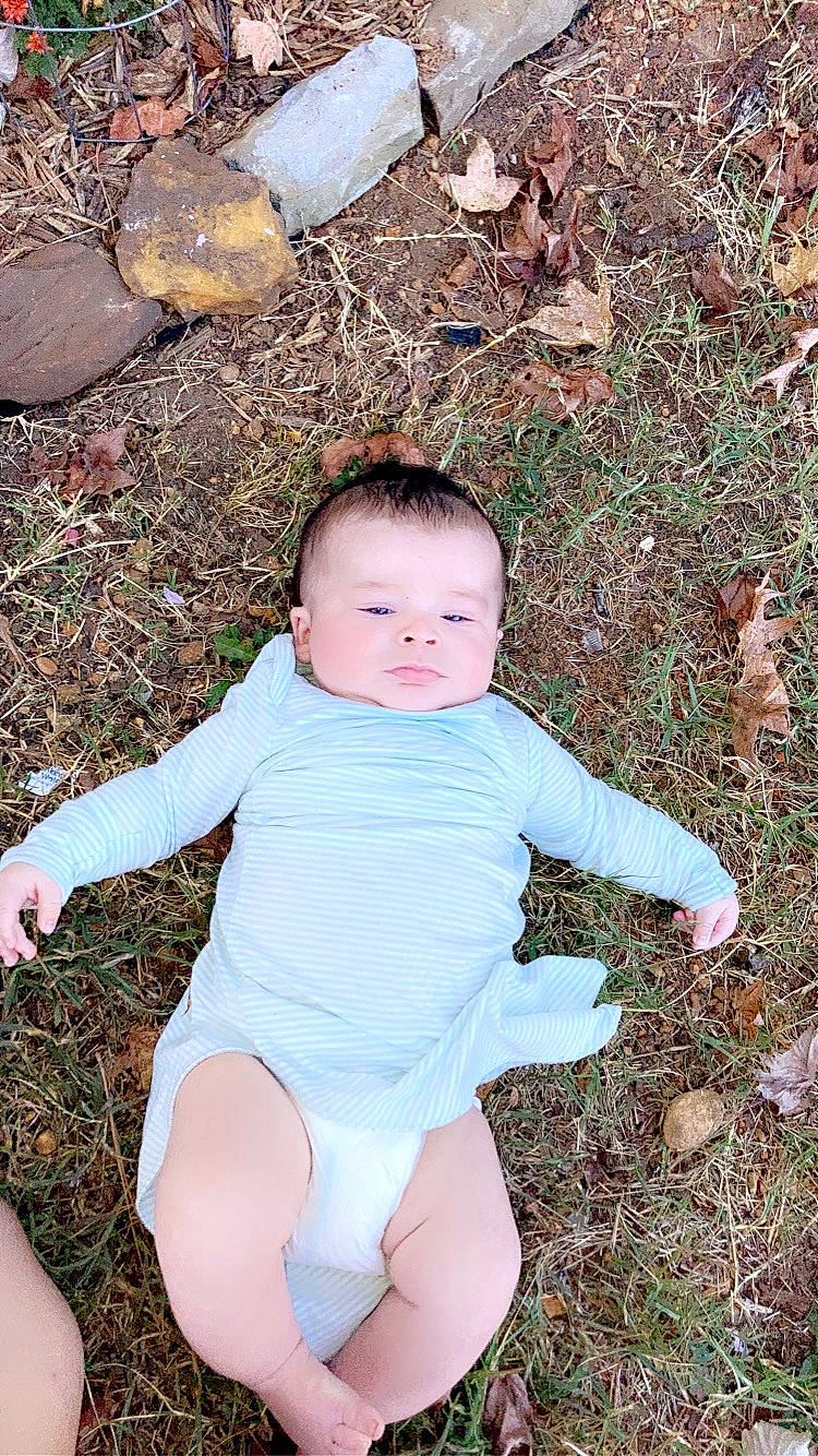 Denver joined the competition — help win amazing prizes! baby, baby_toddler_clothing, chest, child, eye, face, foot, grass, happy, head, human_leg, knee, pattern, people_in_nature, person, sitting, sleeve, stomach, thigh, thumb
