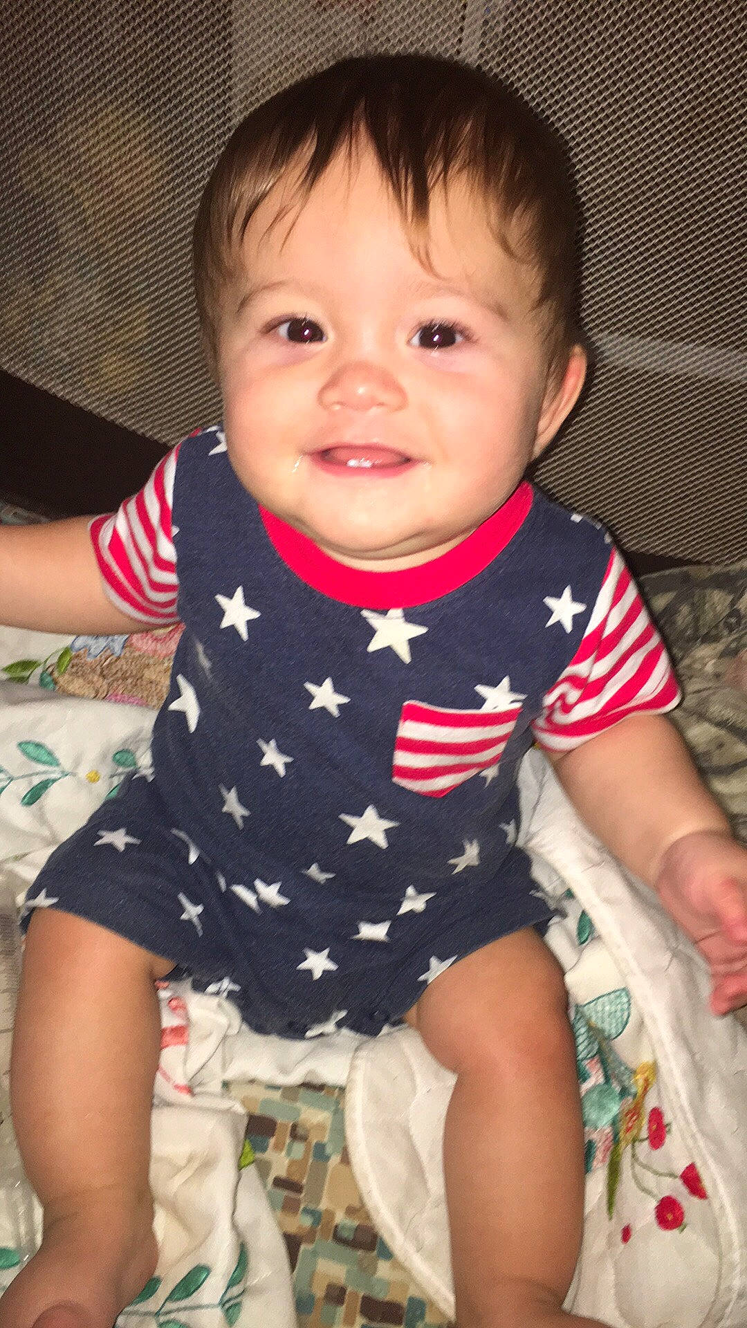 Kelton is registered to the contest to win money with this photo: baby, baby_products, baby_toddler_clothing, cheek, child, eye, face, head, iris, joy, lip, person, sitting, skin, smile, t_shirt, toddler