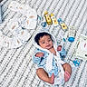 baby, infant, blue_robe, diapers, baby_lotion, baby_oil, baby_powder, baby_brush, baby_comb, baby_scissors, baby_wipes, blanket, floor, baby_care, newborn, child, cute, indoor, resting, soft