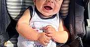Thiago joined the competition — help win amazing prizes! baby, child, car_seat, smiling, happy, sunlight, infant, clothing, seatbelt, portrait, cute, young_child, sitting, baby_clothes, striped, comfort, indoors, person, face, hands