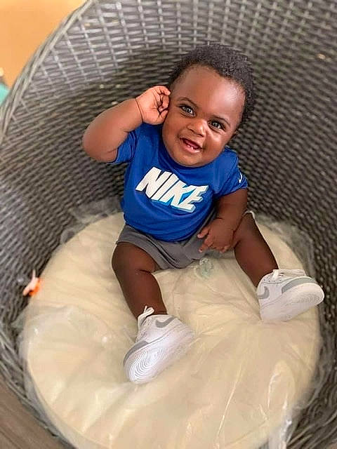 Daveon joined the competition — help win amazing prizes! ankle, baby, baby_toddler_clothing, child, comfort, face, joy, person, plastic, plastic_bag, sitting, sock, toddler