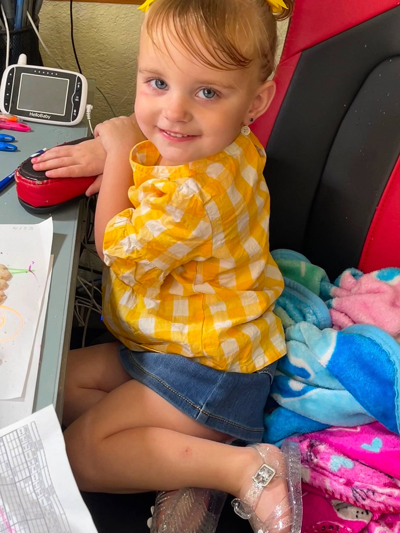 Paislee is registered to the contest to win money with this photo: baby_toddler_clothing, beauty, chair, child, facial_expression, finger, fun, happy, human_leg, joy, knee, lap, leisure, person, shorts, sitting, skin, smile, summer, thigh