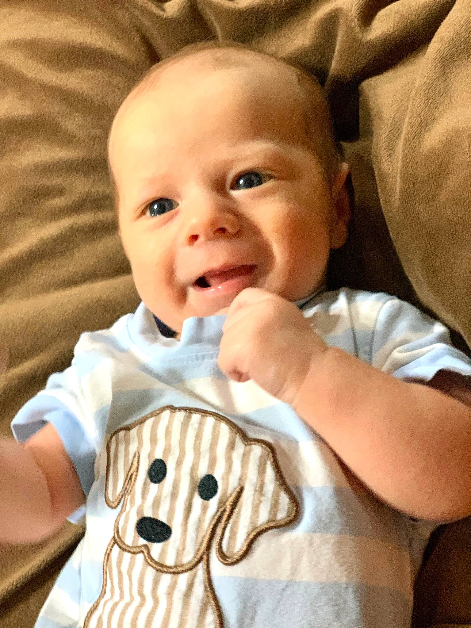 Anderson is registered to the contest to win money with this photo: arm, baby, baby_toddler_clothing, cheek, child, ear, eye, face, facial_expression, gesture, happy, head, human, mouth, nose, person, skin, smile, thumb, toddler