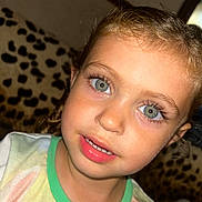 Arabella joined the competition — help win amazing prizes! child, face, blue_eyes, curly_hair, smile, portrait, close_up, couch, leopard_print, indoor, tshirt, young_child, person, skin, eyelashes, mouth, clothing, head, expression, cute