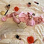 Mènciya a rejoint le concours — aidez-le/la à gagner de superbes lots ! baby, infant, newborn, blanket, pink, headband, bow, diaper, makeup_brush, makeup, perfume, lipstick, compact, petals, lying_down, milestone_card, three_months, cozy, portrait, smiling