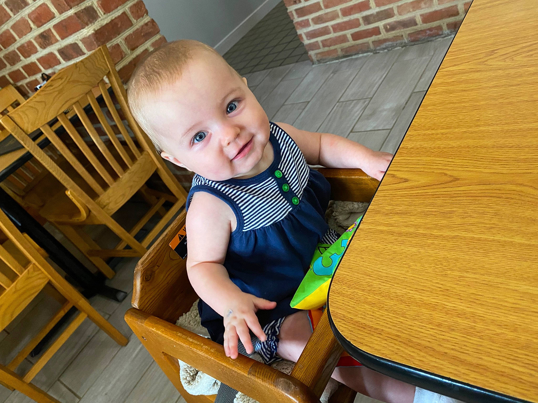 Madison Sage joined the competition — help win amazing prizes! baby, baby_toddler_clothing, chair, cheek, child, comfort, floor, flooring, fun, happy, hardwood, leisure, outdoor_furniture, person, sitting, skin, smile, toddler, varnish, wood