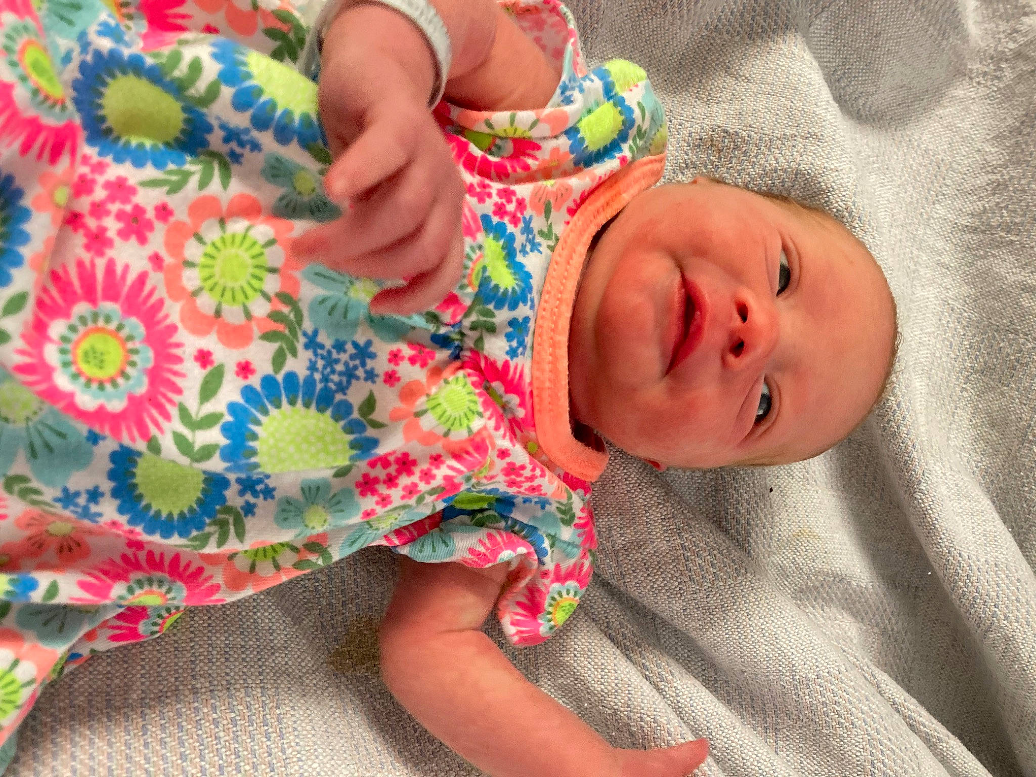 Alivia is registered to the contest to win money with this photo: baby, baby_toddler_clothing, comfort, dress, eye, finger, hand, happy, hat, head, linens, lip, nail, nose, pattern, person, skin, sleeve, smile, textile