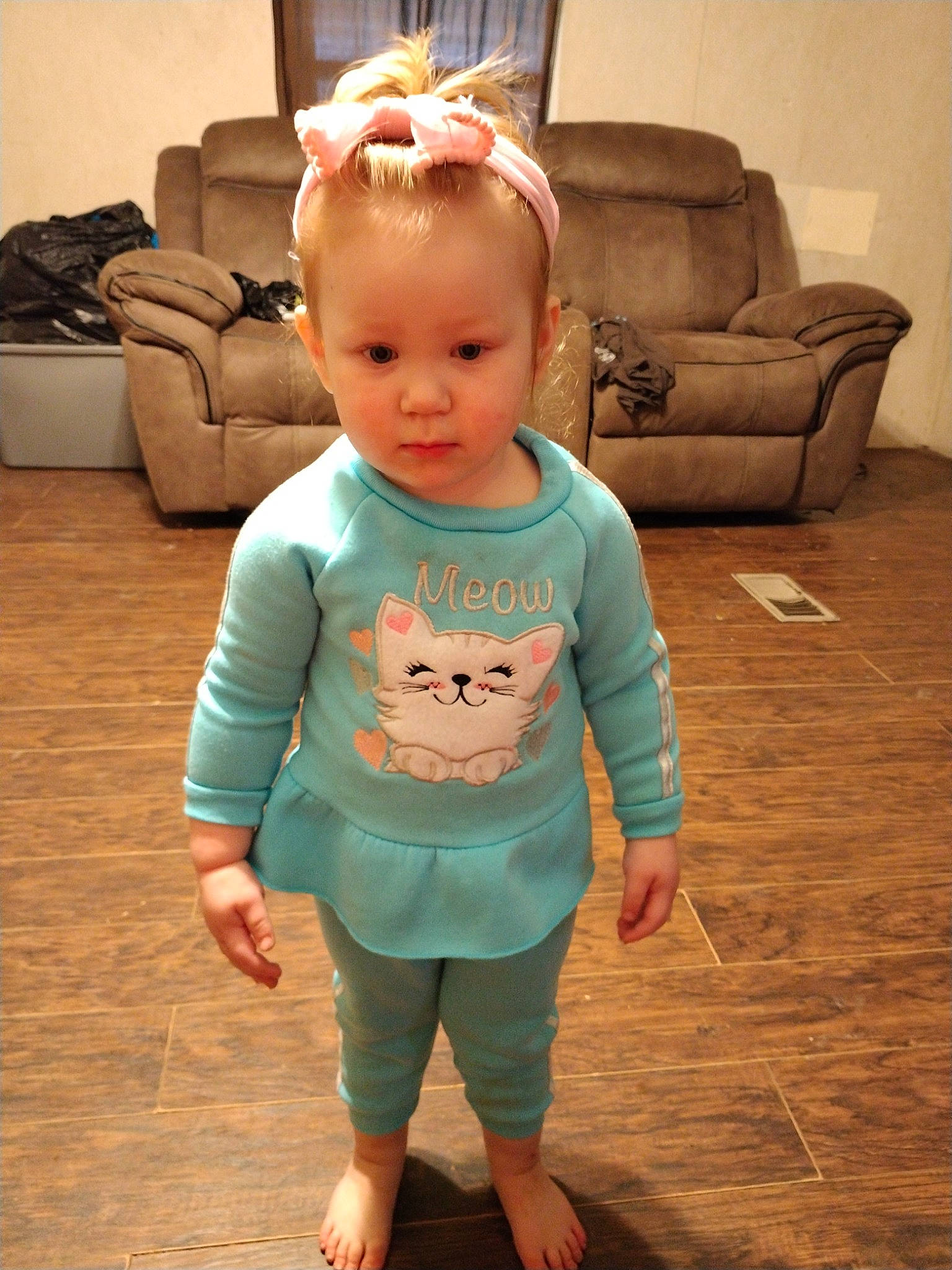 Brittany is registered to the contest to win money with this photo: baby, baby_toddler_clothing, cheek, comfort, couch, floor, flooring, hair, hairstyle, hardwood, joint, neck, person, skin, sleeve, sportswear, t_shirt, textile, toddler, waist