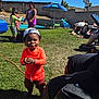 Miles joined the competition — help win amazing prizes! child, toddler, grass, outdoor, sunny, play, backyard, ball, cap, orange_clothing, kids, umbrella, pool, fence, adult, relaxing, summer, shoes, toy, person