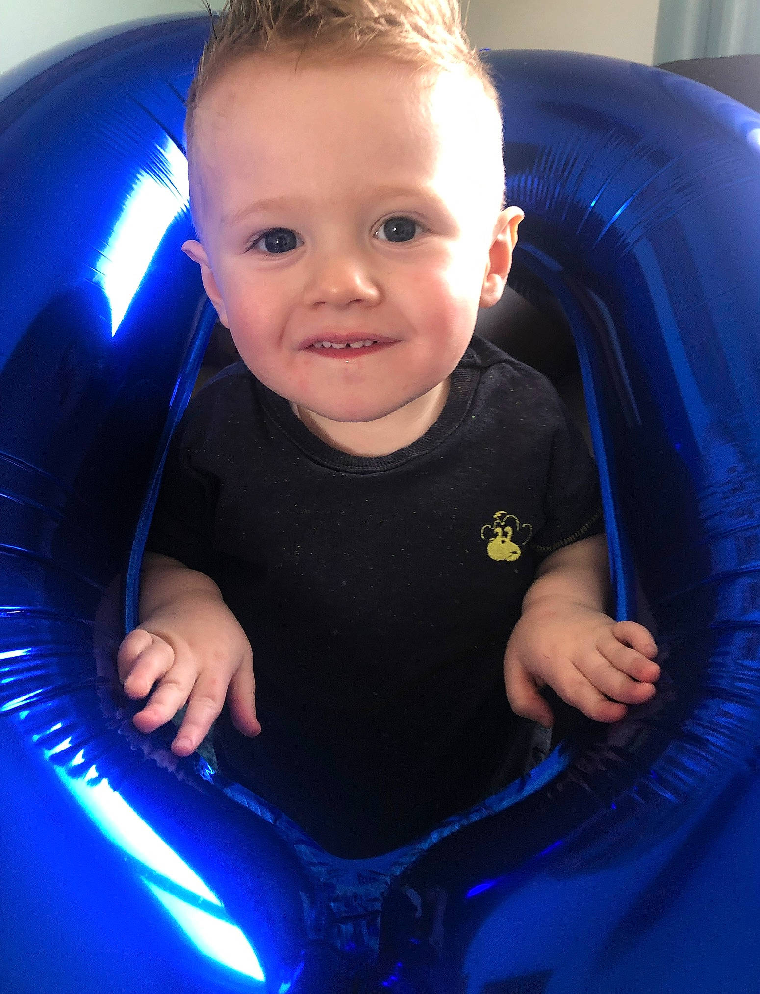 Teddie is registered to the contest to win money with this photo: baby, baby_products, blue, child, cobalt_blue, electric_blue, eye, face, fun, games, inflatable, leisure, person, personal_protective_equipment, play, product, recreation, skin, smile, toddler