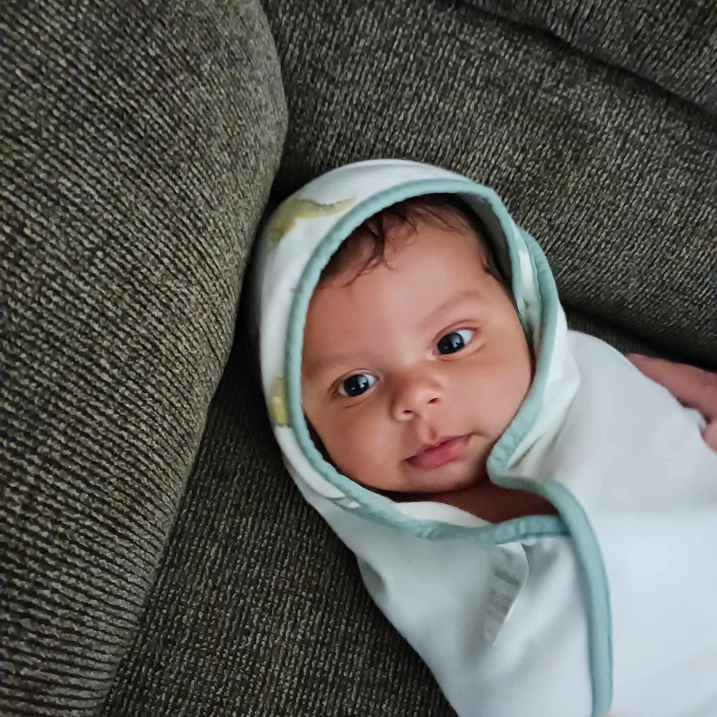Antonio joined the competition — help win amazing prizes! baby, bodypart, bonnet, cap, clothing, couch, face, finger, furniture, hat, head, hood, hoodie, knitwear, newborn, person, photography, portrait, sweater, sweatshirt