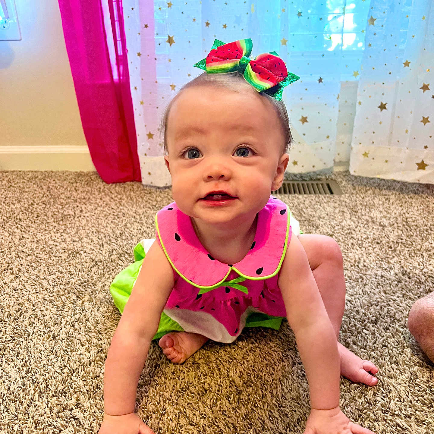 Lainey joined the competition — help win amazing prizes! baby, carpet, child, crawling, curtains, cute, face, feet, floor, green, hands, home, indoor, natural_light, person, pink, smiling, stars, watermelon_bow, watermelon_dress