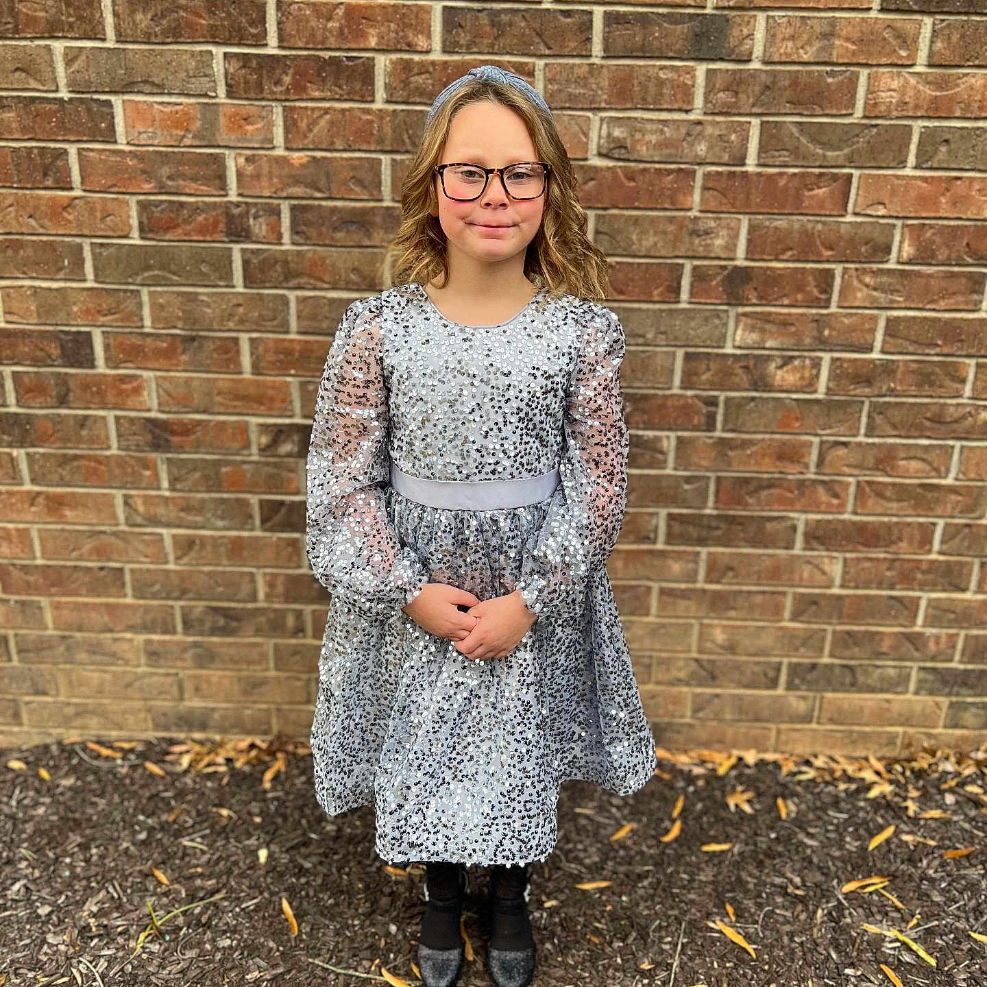 Avagrace is registered to the contest to win money with this photo: architecture, blonde, brick, building, clothing, coat, dress, eveningdress, face, formalwear, hair, head, lady, person, photography, portrait, sitting, sleeve, standing, wall