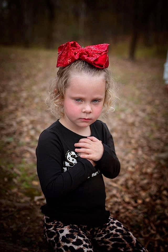 Avagrace is registered to the contest to win money with this photo: beauty, cap, child, eye, flash_photography, grass, happy, headband, headpiece, human, leaf, lip, pattern, person, plant, red, standing, sunlight, toddler, tree