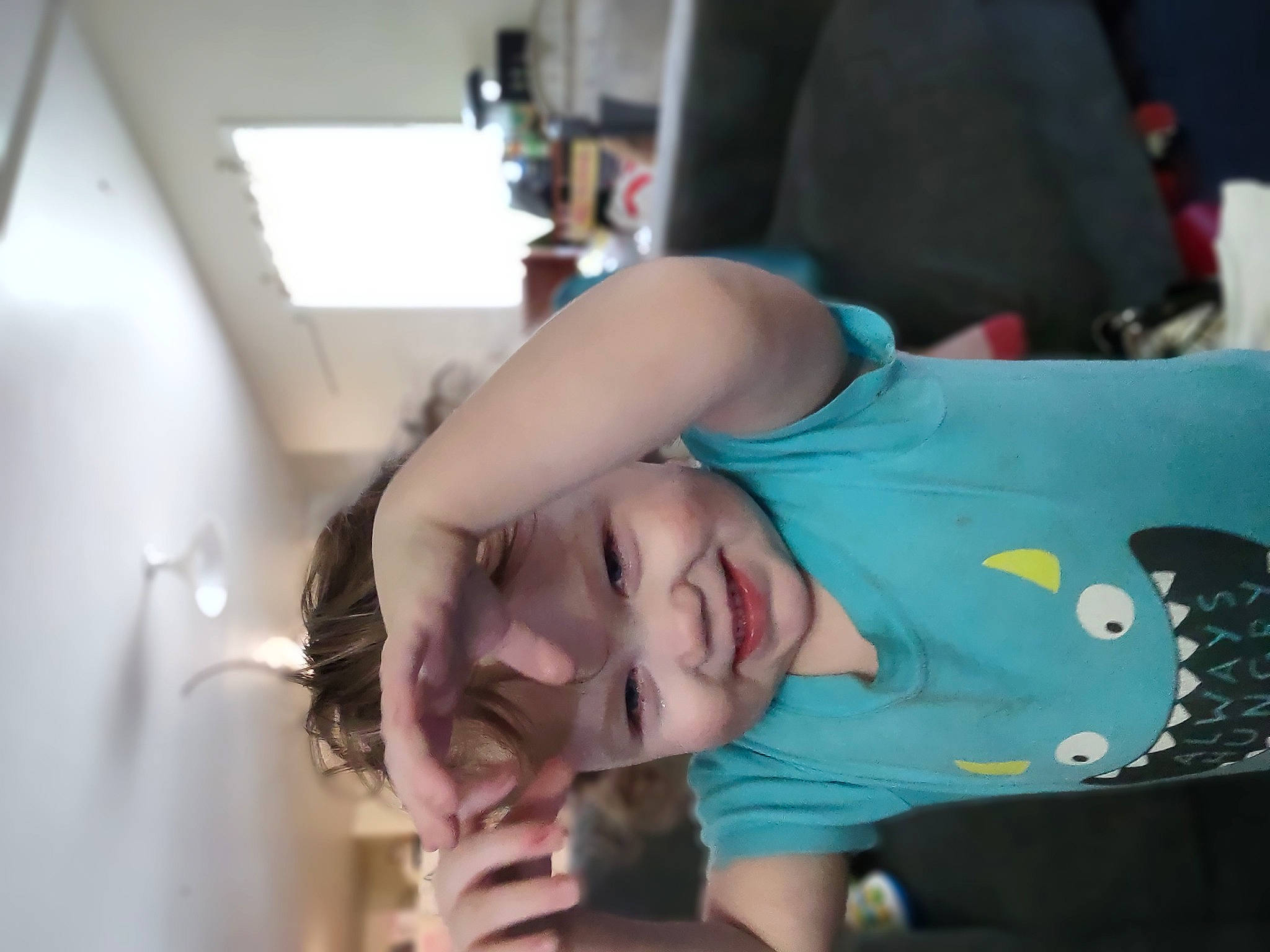 Sanza is registered to the contest to win money with this photo: child, elbow, eyelash, fun, happy, headwear, joy, mouth, person, room, t_shirt, toddler