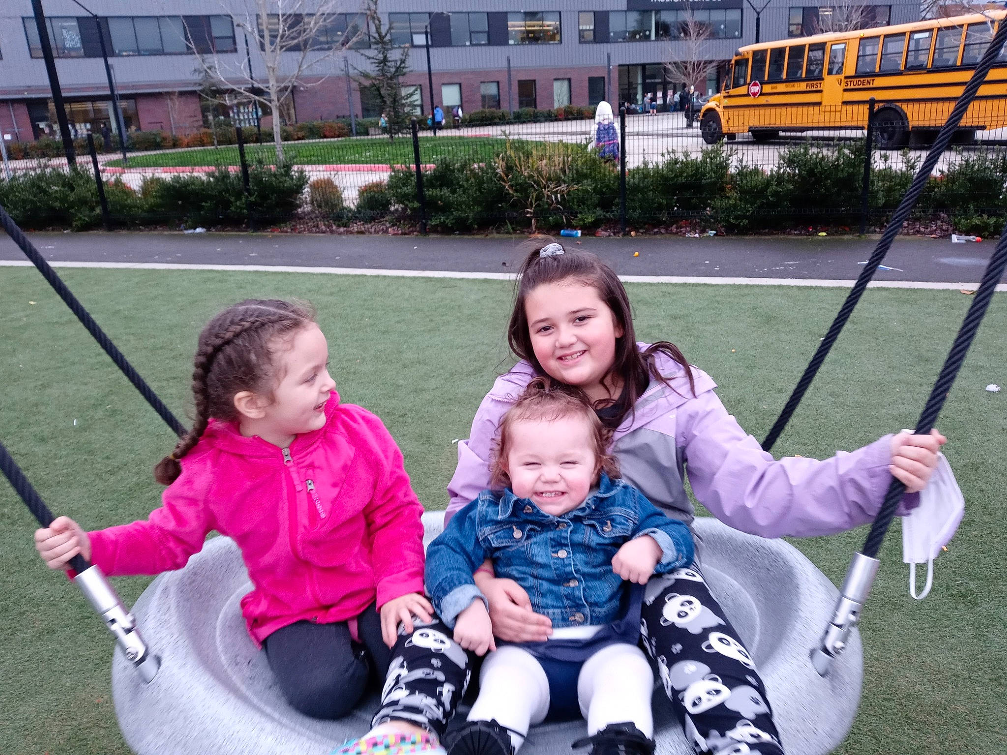 Harmony is registered to the contest to win money with this photo: baby_toddler_clothing, bus, child, eye, fun, grass, happy, jacket, joy, lap, leisure, people, person, photograph, plant, public_space, recreation, smile, swing, toddler