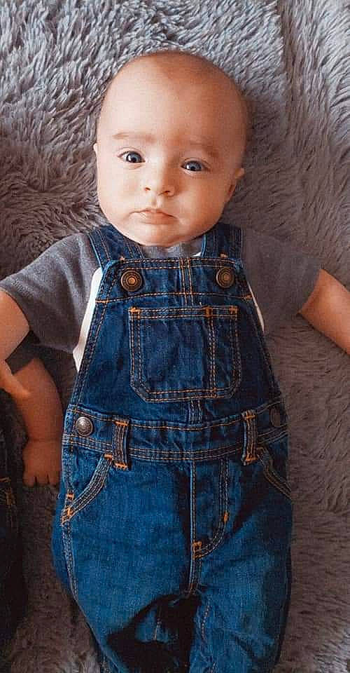 Joey is registered to the contest to win money with this photo: baby_toddler_clothing, cheek, collar, day_dress, dress_shirt, eye, eyelash, face, head, human_body, iris, lip, neck, one_piece_garment, outerwear, pattern, person, skin, sleeve, textile