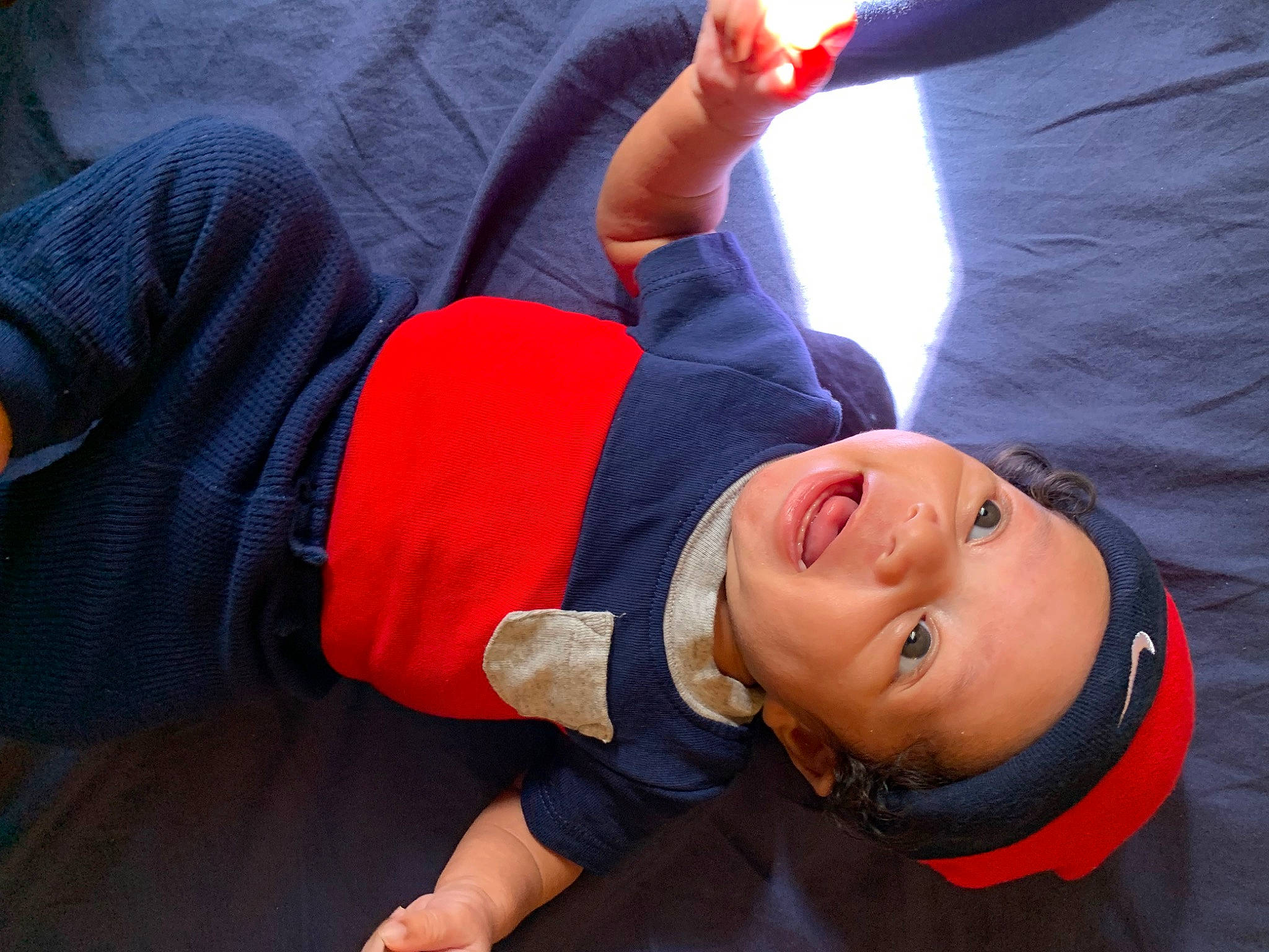 Eziah joined the competition — help win amazing prizes! child, elbow, electric_blue, fun, gesture, happy, headgear, human_leg, joint, knee, leisure, mouth, person, recreation, sitting, sleeve, smile, t_shirt, thigh, thumb