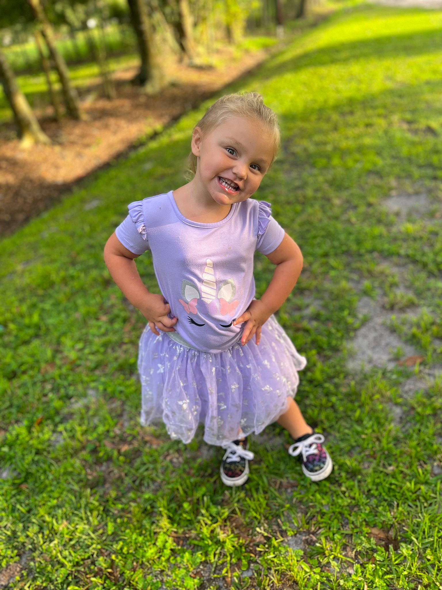 Juliana joined the competition — help win amazing prizes! baby_toddler_clothing, botany, child, dress, face, fun, grass, grassland, groundcover, happy, joy, leaf, leisure, natural_environment, people_in_nature, person, plant, shoe, smile, toddler