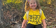 Isley is registered to the contest to win money with this photo: child, clothing, face, female, girl, grove, head, land, nature, outdoors, pants, person, photography, plant, portrait, t_shirt, tree, vegetation, wilderness, woodland