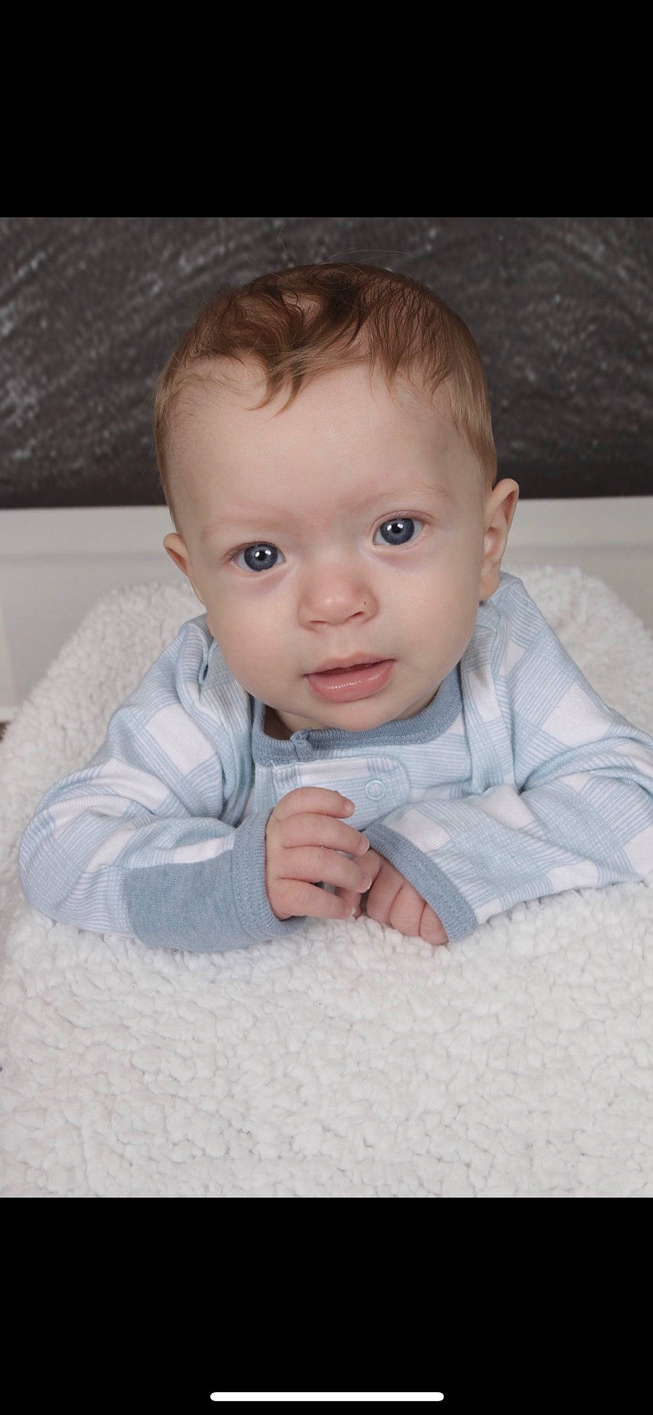Leonardo is registered to the contest to win money with this photo: baby, baby_toddler_clothing, cheek, child, chin, comfort, facial_expression, flash_photography, floor, flooring, human_body, iris, linens, nose, person, sitting, skin, sleeve, smile, toddler