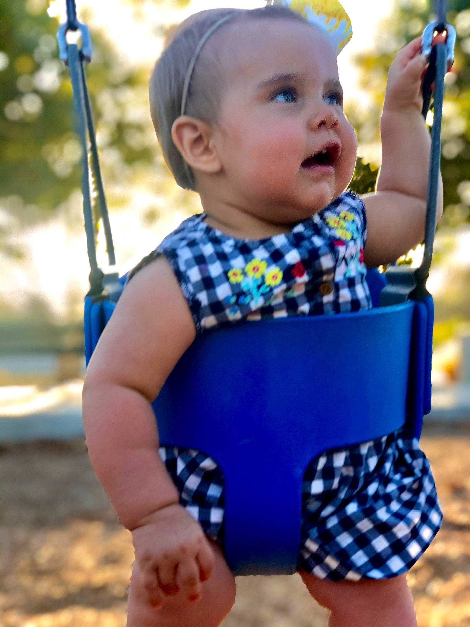 Allie joined the competition — help win amazing prizes! baby, baby_products, baby_toddler_clothing, child, design, electric_blue, happy, outdoor_play_equipment, pattern, person, play, playground, polka_dot, public_space, smile, swing, toddler, vacation