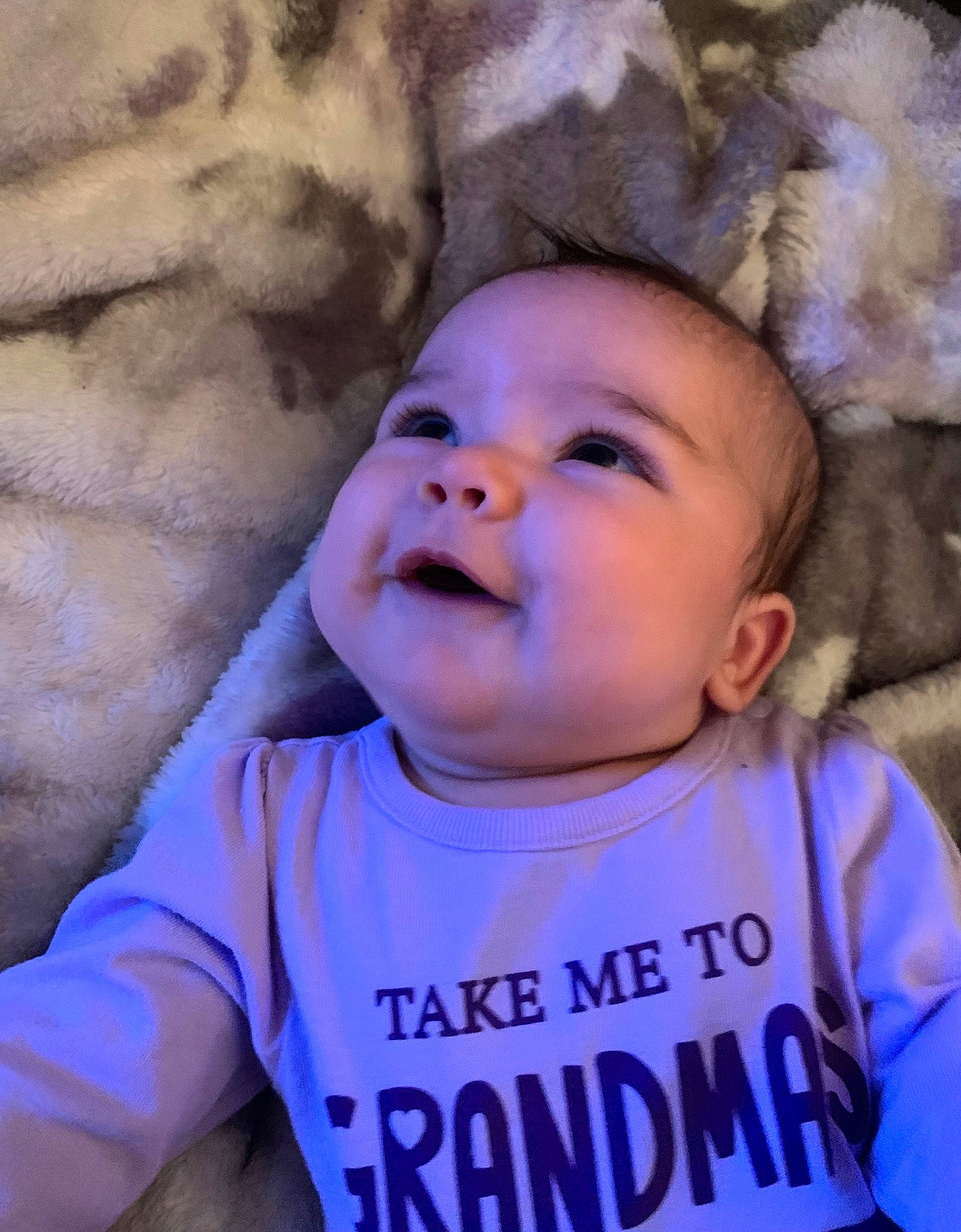 Mira is registered to the contest to win money with this photo: baby, baby_laughing, baby_toddler_clothing, cheek, child, chin, cool, eye, facial_expression, happy, iris, mouth, nose, organ, person, purple, skin, sleeve, smile, t_shirt