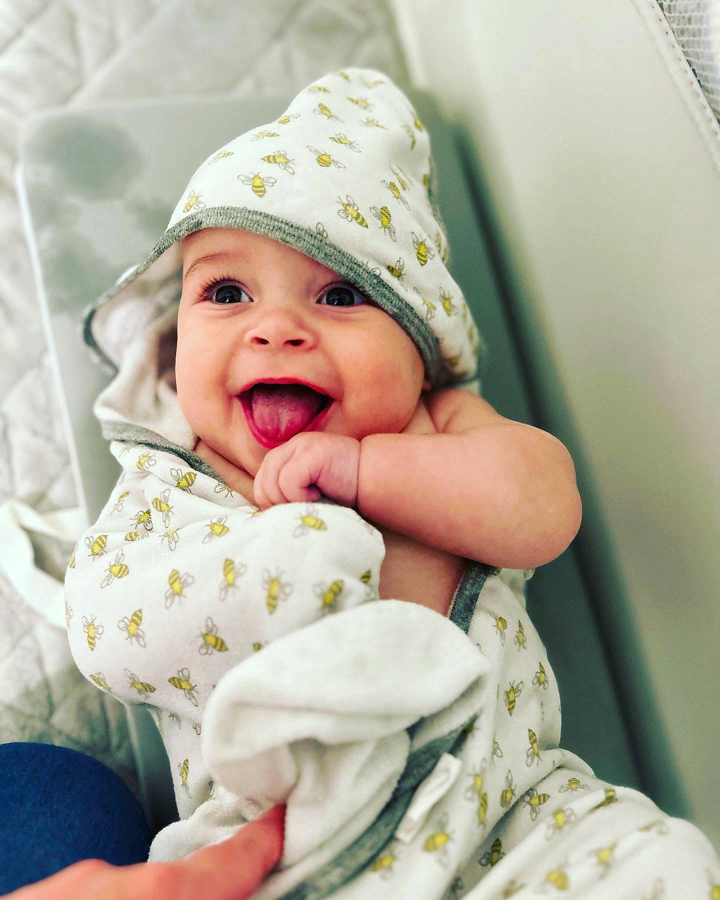 Brody is registered to the contest to win money with this photo: baby, baby_laughing, baby_products, baby_sleeping, baby_toddler_clothing, cap, cheek, child, comfort, face, fashion_accessory, gesture, happy, headwear, laugh, linens, person, skin, sleeve, smile