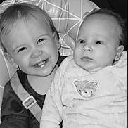 Jayden-Jamie is registered to the contest to win money with this photo: baby, baby_clothes, butterfly, child, clothing, cushion, cute, expression, face, furniture, happy, high_chair, indoor, infant, people, portrait, seat_belt, smiling, soft_toy, toddler