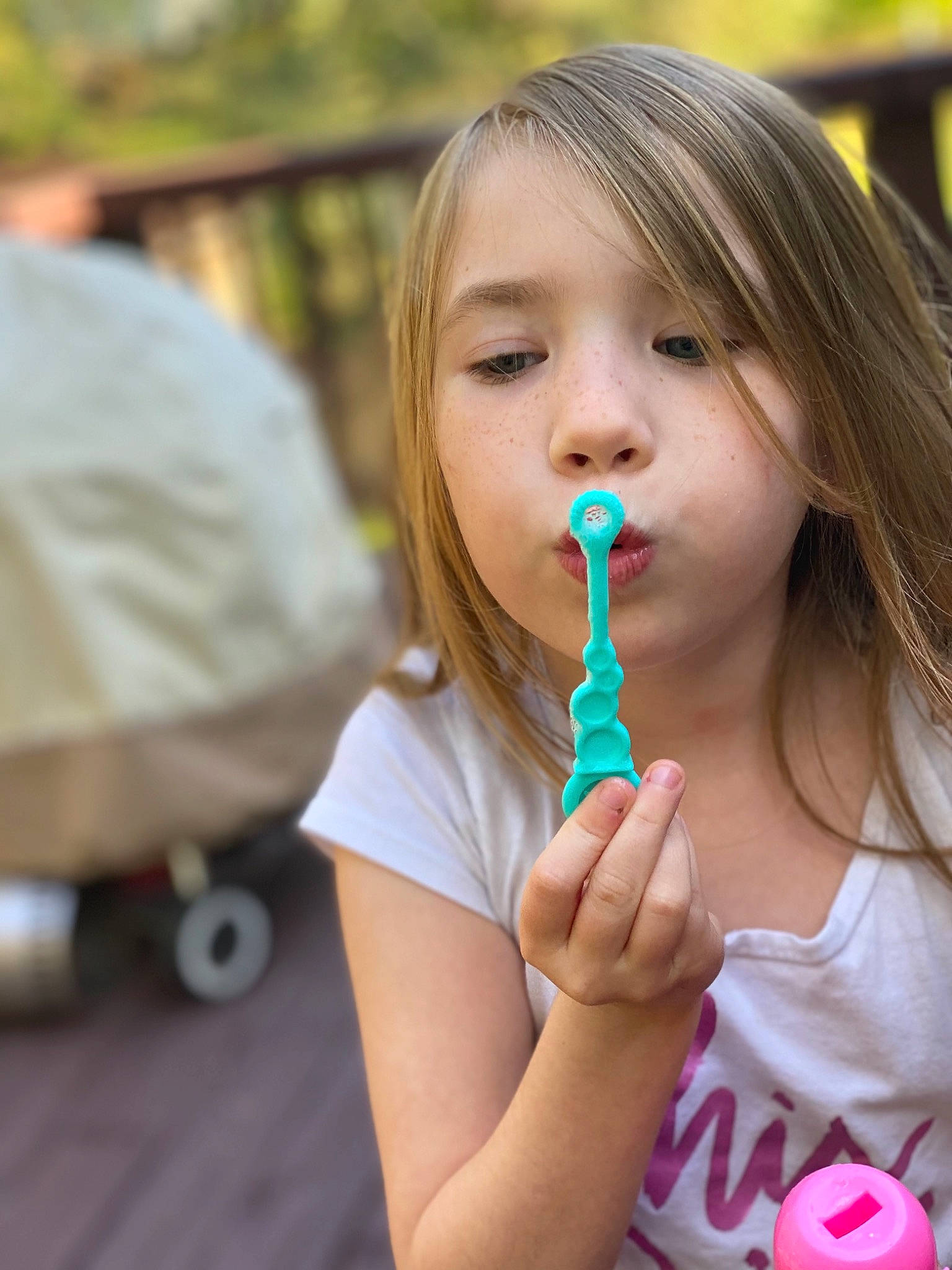 Arianna is registered to the contest to win money with this photo: child, finger, food, frozen_dessert, fun, grass, happy, hard_candy, ice_cream, leisure, lip, lollipop, neck, person, pink, sweetness, tableware, tire, toddler, vacation