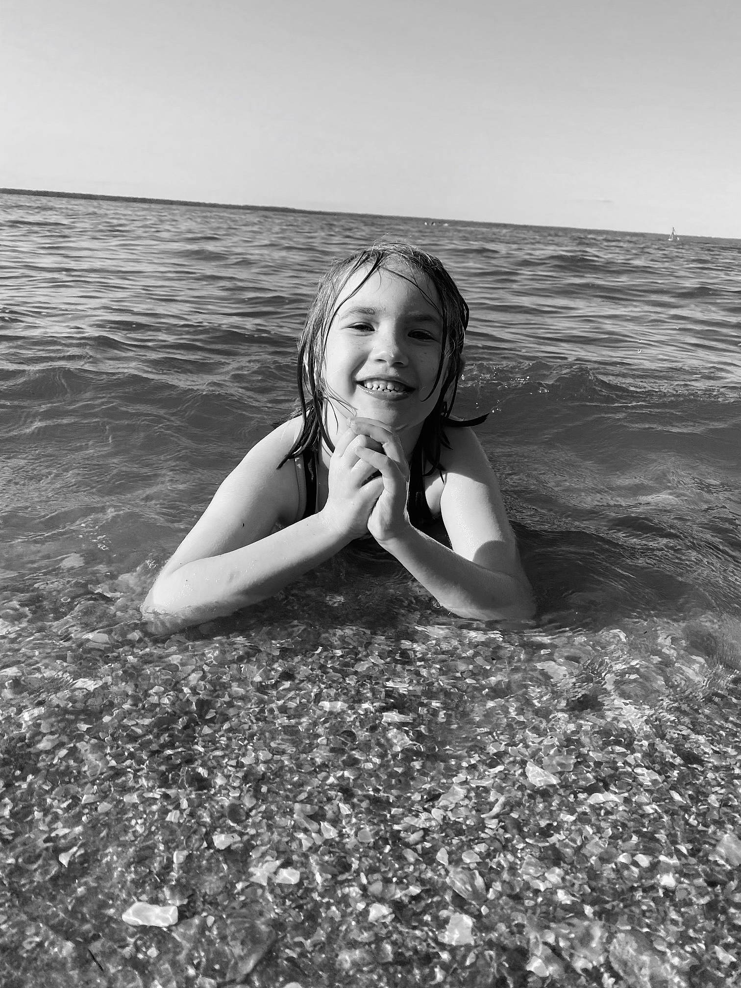 Arianna joined the competition — help win amazing prizes! beach, black_and_white, flash_photography, fun, grass, happy, horizon, joy, lake, landscape, long_hair, monochrome, monochrome_photography, people_in_nature, person, sand, sky, smile, standing, style