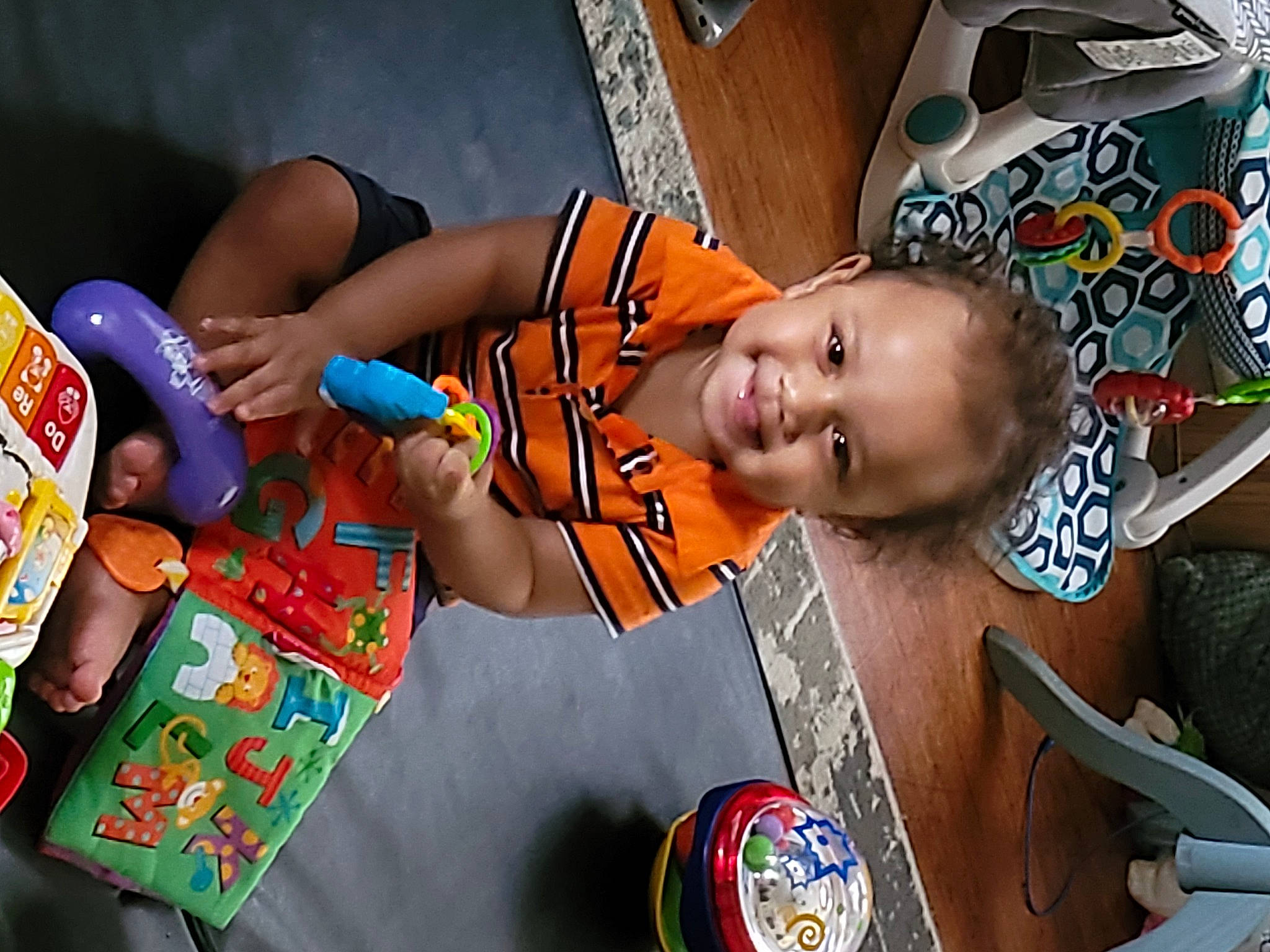 Cash is registered to the contest to win money with this photo: adaptation, baby, child, event, facial_expression, fun, happy, joy, leisure, person, play, product, room, skin, smile, snapshot, t_shirt, toddler, tradition, tribe